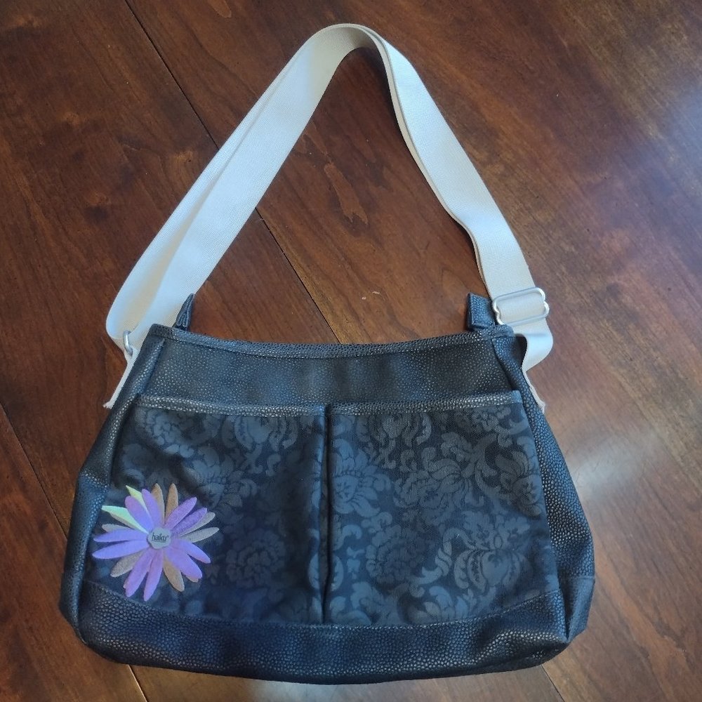 Haiku black, purple, and green shoulder bag